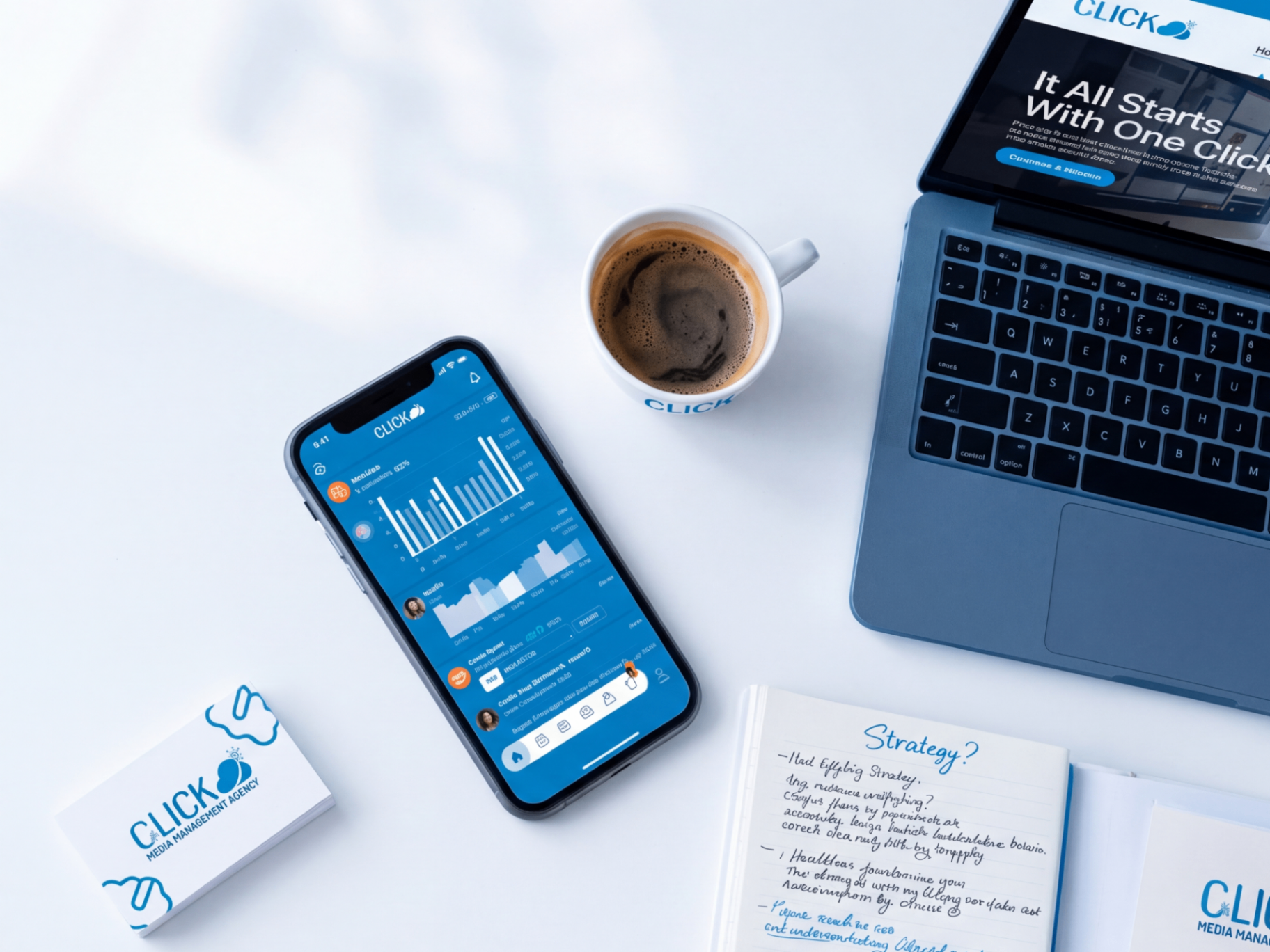 Creative workspace with social media analytics on a phone, strategy notes, and branding materials